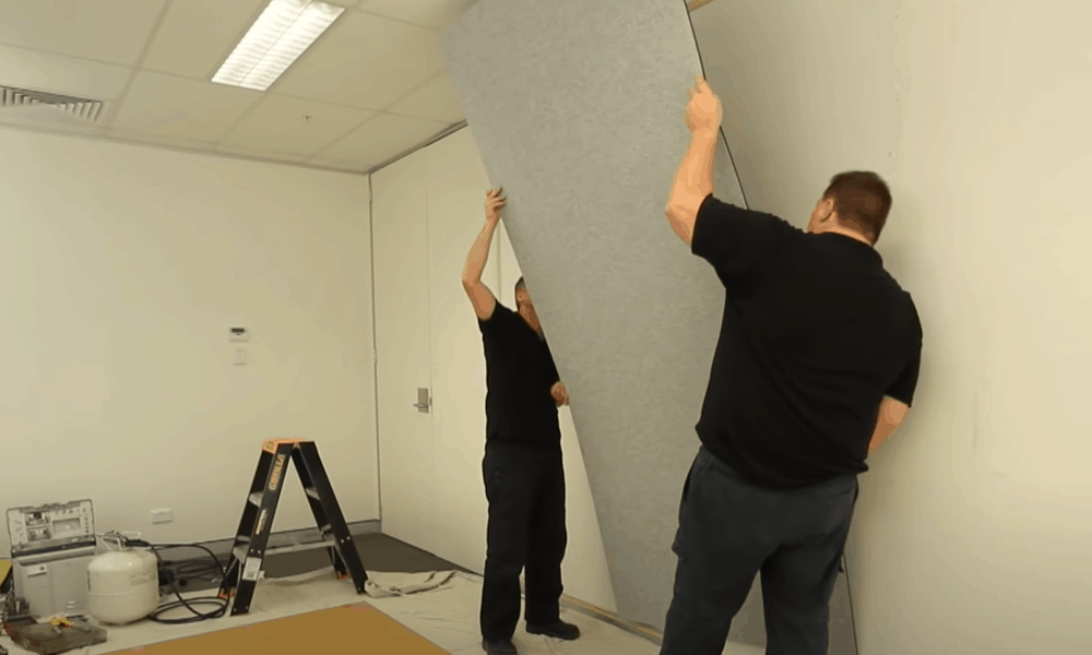 Install acoustic panels on the wall